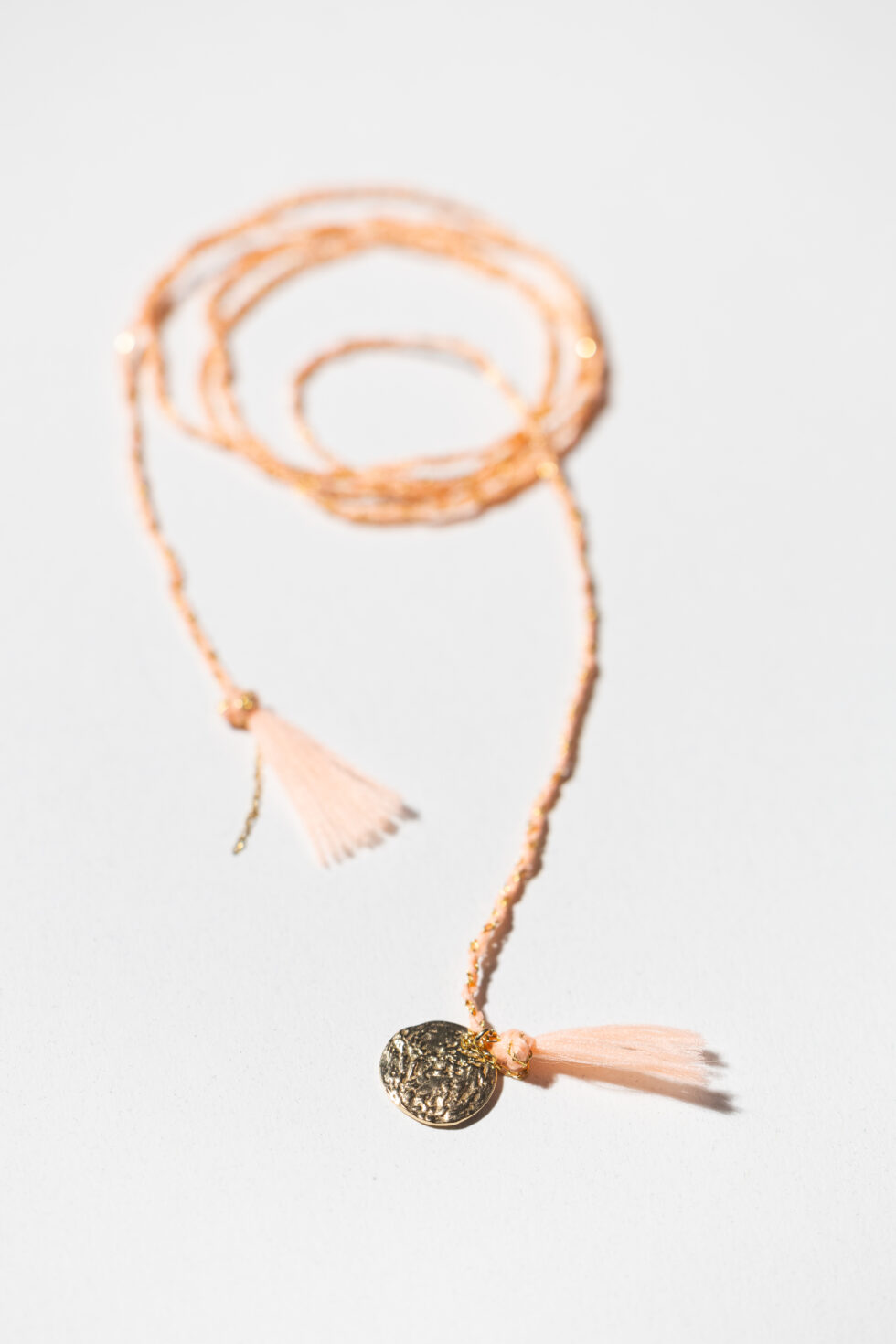 Gold-plated necklace made with apricot nylon thread