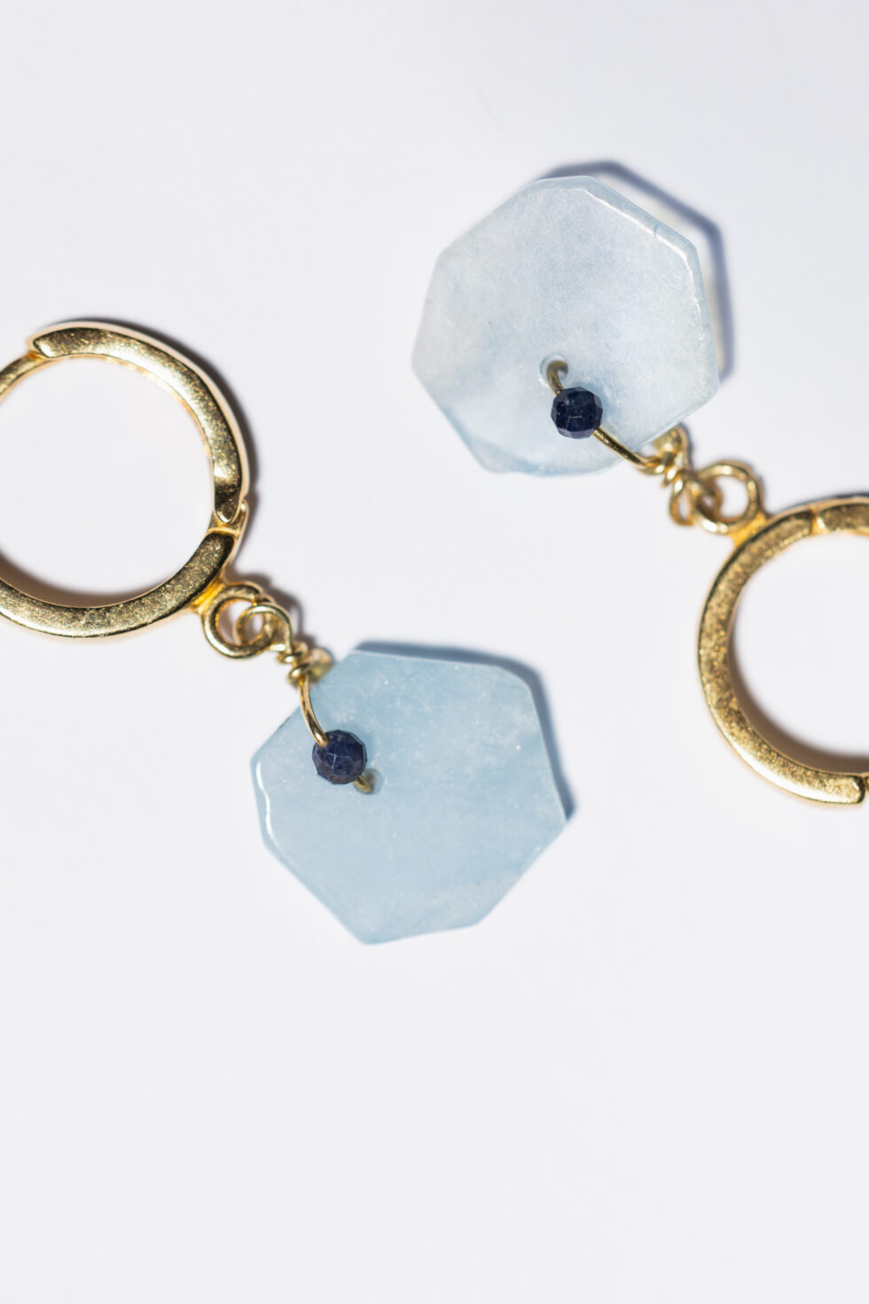Golden earrings with aquamarine and sapphire